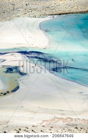 Amazing view of Balos Lagoon with magical turquoise waters, lagoons, tropical beaches of pure white sand and Gramvousa island on Crete, Greece