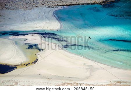Amazing view of Balos Lagoon with magical turquoise waters, lagoons, tropical beaches of pure white sand and Gramvousa island on Crete, Greece