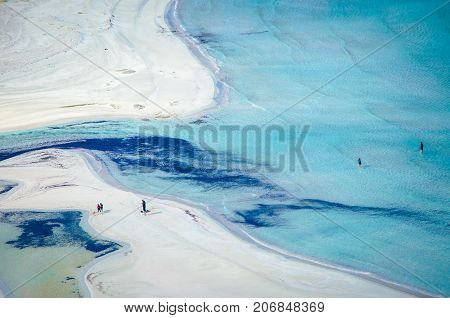 Amazing view of Balos Lagoon with magical turquoise waters, lagoons, tropical beaches of pure white sand and Gramvousa island on Crete, Greece