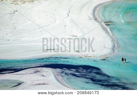 Amazing view of Balos Lagoon with magical turquoise waters, lagoons, tropical beaches of pure white sand and Gramvousa island on Crete, Greece