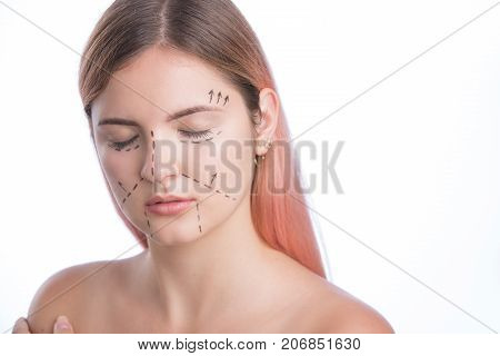 Beautiful girl white studio background perforation lines on face