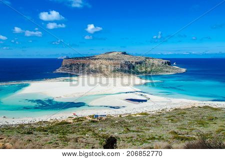 Amazing view of Balos Lagoon with magical turquoise waters, lagoons, tropical beaches of pure white sand and Gramvousa island on Crete, Greece