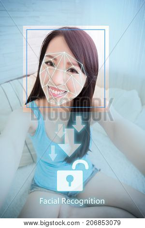 young woman is taking selfie for facial recognition concept