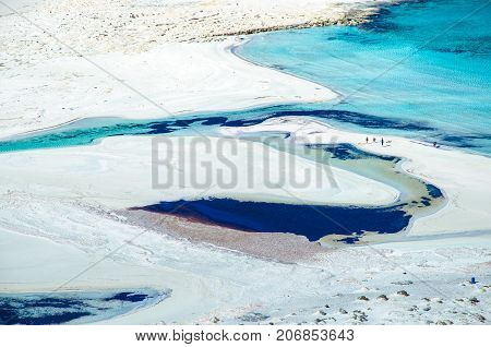 Amazing view of Balos Lagoon with magical turquoise waters, lagoons, tropical beaches of pure white sand and Gramvousa island on Crete, Greece