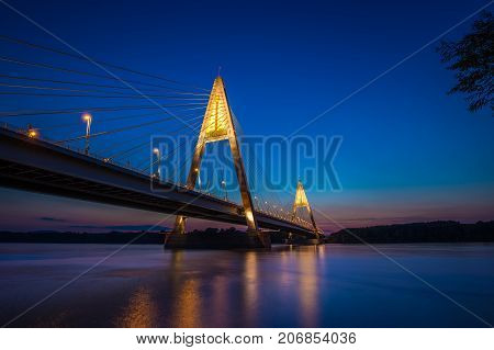 Budapest Hungary - The illuminated Megyeri Bridge over river Danube at blue hour with colorful clear sky