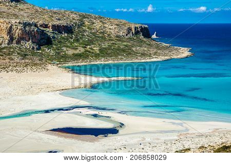 Amazing view of Balos Lagoon with magical turquoise waters, lagoons, tropical beaches of pure white sand and Gramvousa island on Crete, Greece