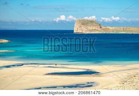Amazing view of Balos Lagoon with magical turquoise waters, lagoons, tropical beaches of pure white sand and Gramvousa island on Crete, Greece