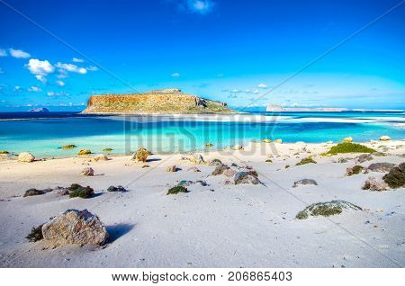 Amazing view of Balos Lagoon with magical turquoise waters, lagoons, tropical beaches of pure white sand and Gramvousa island on Crete, Greece