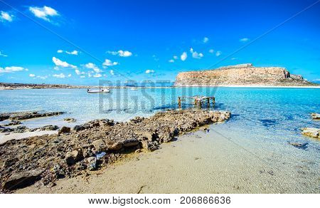 Amazing view of Balos Lagoon with magical turquoise waters, lagoons, tropical beaches of pure white sand and Gramvousa island on Crete, Greece