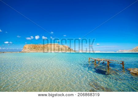 Amazing view of Balos Lagoon with magical turquoise waters, lagoons, tropical beaches of pure white sand and Gramvousa island on Crete, Greece