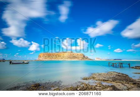 Amazing view of Balos Lagoon with magical turquoise waters, lagoons, tropical beaches of pure white sand and Gramvousa island on Crete, Greece