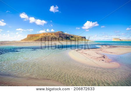 Amazing view of Balos Lagoon with magical turquoise waters, lagoons, tropical beaches of pure white sand and Gramvousa island on Crete, Greece