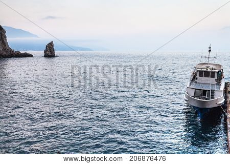 View Of Moored Ship And Parus Rock In Crimea