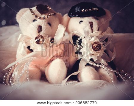 love concept : couple teddy bears in wedding dress for valentine greeting card with bokeh background. love concept wallpaper. wedding invitation card