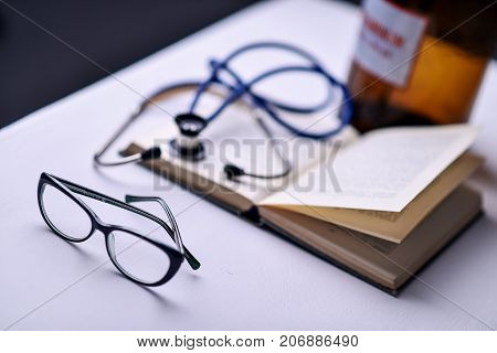 Stethoscope and book on Desk in a medical office