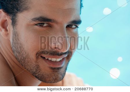 Young Man Sitting In Swimming Pool
