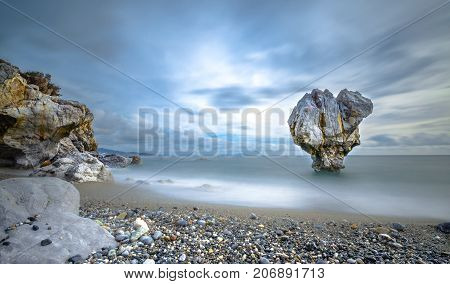 Lonely rock sculpture at the shape of heart, Preveli, Crete, Greece