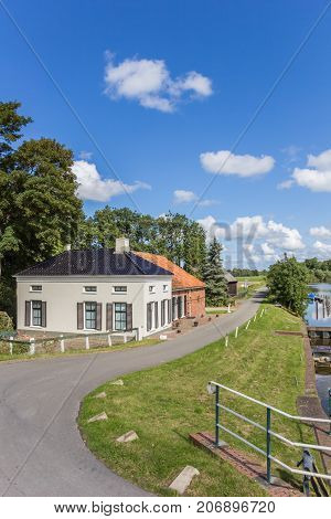 Old house and rural road in Groningen Netherlands