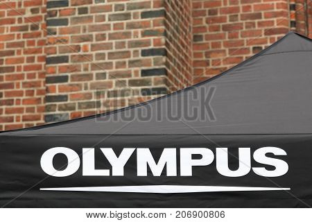 Odense, Denmark - August 19, 2017: Olympus logo on a tent. Olympus is a Japanese manufacturer of optics and reprography products