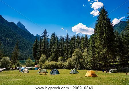 Camping on the shores of lake. Lake Dobbiaco in the Dolomites, Beautiful Nature Italy natural landscape Alps.