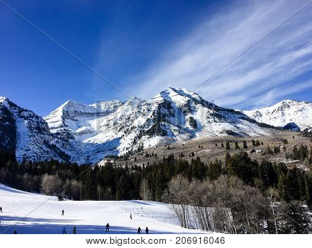 People Skiing Down A Mountain