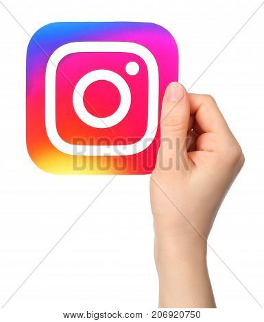 Kiev Ukraine - January 20 2017: Hands holds Instagram icon printed on paper. Instagram is an online mobile photo-sharing video-sharing service