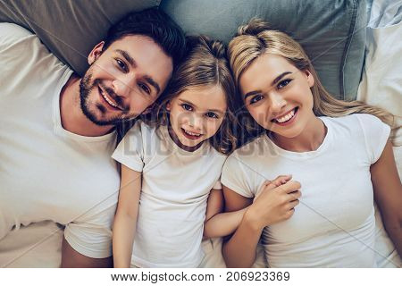 Family In Bedroom