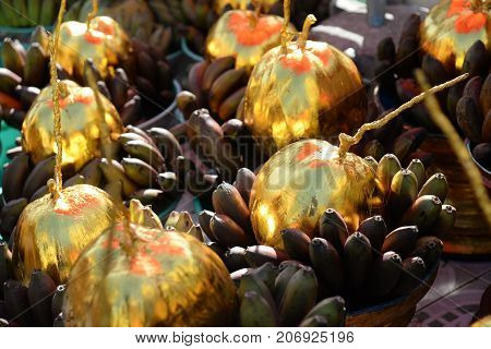 Baskets of sacrificial offering bananas and coconuts for donation in Botataung Pagoda Yangon Myanmar (Burma)