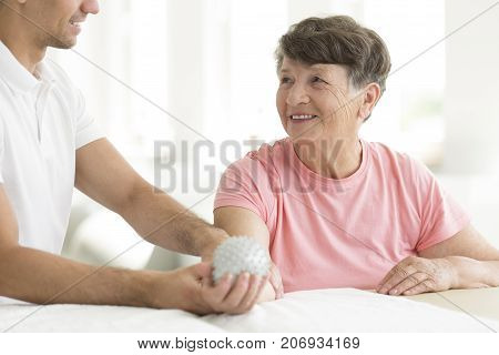Patient Holding Spiked Rehabilitation Ball