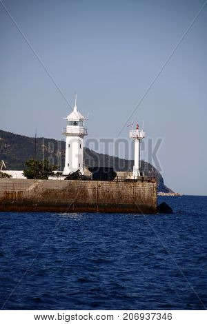 Grand White Washed Lighthouse Looks Over The Deep Of The Black Sea