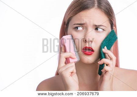 Beautiful Surprised Woman Hold Colorful Sponge For Cleaing Face
