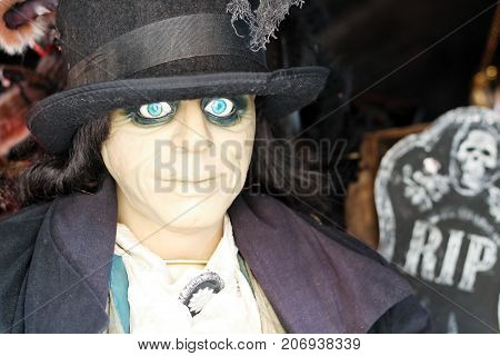 Scary man with blue eyes standing. Halloween
