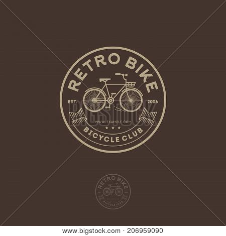 Retro bike logo. Cycling club emblem. Letters, ribbon and bicycle in the circle.