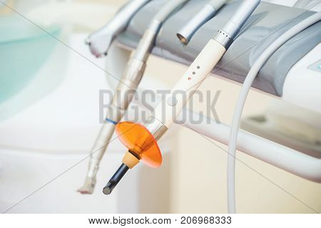 Dental UV curing light lamp . Ultraviolet polymerization lamp with Orange blocking glass. tooth care concept