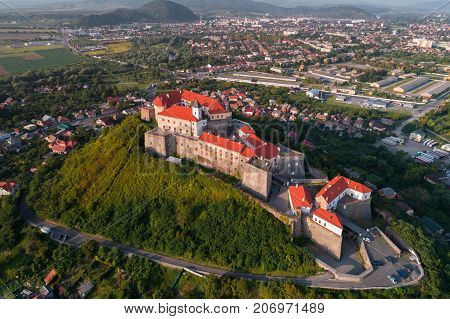 Aerial view of the Majestic Fortress - Palanok Castle towering above the city of Mukacheve, Ukraine.