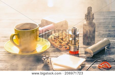 Still Life With Electronic Cigarette With Botle And Coffe On The Wooden Background