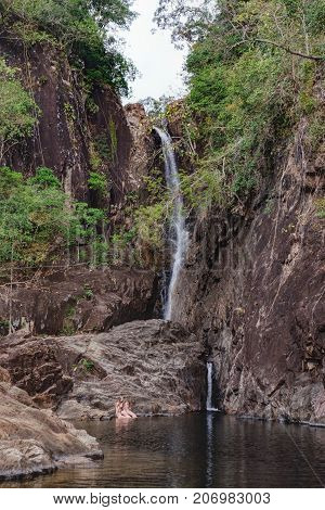 Koh Chang, Thailand - December 20, 2015: An unidentified children swimming playing and enjoying in water of the Khlong Phlu Waterfall, Mu Koh Chang National Park.