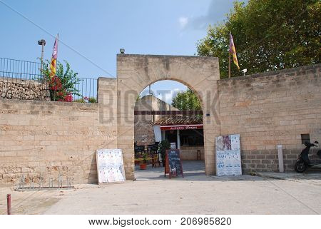 MAJORCA, SPAIN - SEPTEMBER 8, 2017: The entrance of the Plaza de Toros bullring in Alcudia on the Spanish island of Majorca. In 2017 the Balearic islands passed major restrictions on bull fighting.