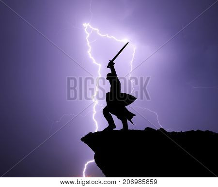 Warrior silhouette and lightning. Strenght and power conceptual scene.