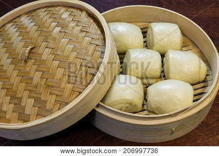 Delicious steam Chinese buns in a bamboo basket