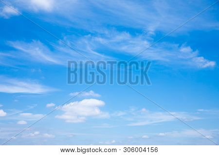 Deep Blue Sunny Sky With White Clouds. Blue Sky With Cloud Closeup. White Fluffy Clouds In The Blue 