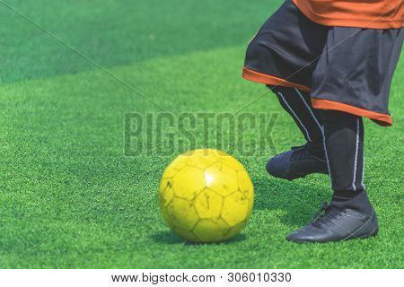 Children Is Training And Dibbling Ball In Soccer Training