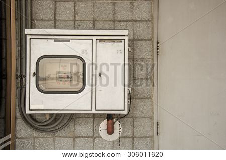 Metal Electricity Control Box With Sign On The Wall