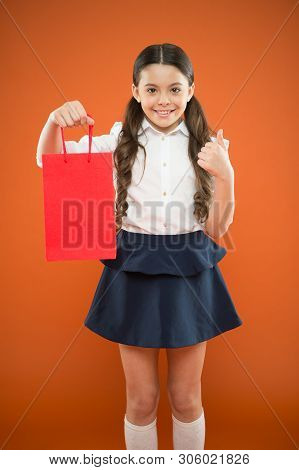 Thumbs Up For Sale. Cute Small Child Showing Ok Sign To Purchase Bought At Sale On Orange Background
