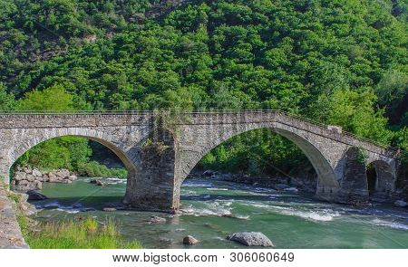 The Medieval  Bridge Of Echallod In Arnad,  Over The River  Dora Baltea In Aosta Valley//italy.it Is