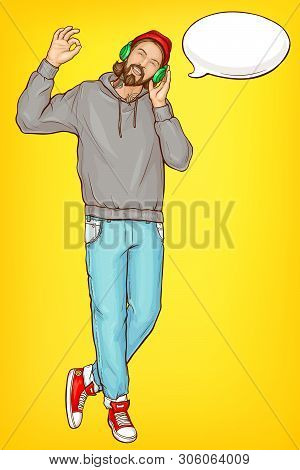 Smiling Hipster Man In Hoody, Jeans And Sneakers, Listening Music With Headphones, Talking On Phone 