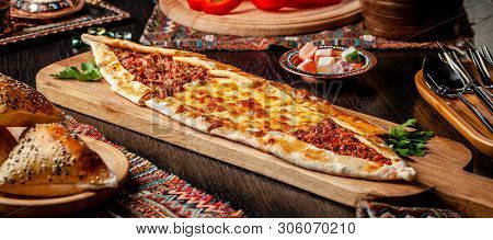 Traditional Turkish Cuisine. Turkish Pizza Pita With A Different Stuffing, Meat, Cheese, Slices Of V
