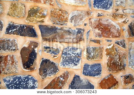 Rustic Stone Wall Close Up As Background