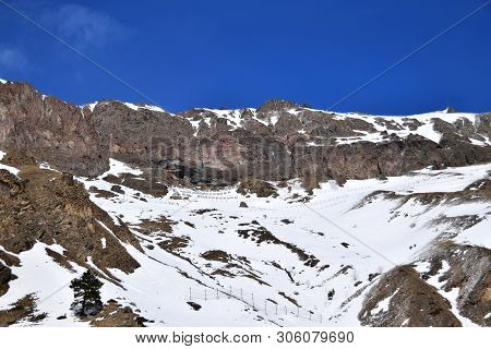 View Of The Snowy Mountain Range And Blue Sky, Avalanche Traps At The Foot Of Mount Elbrus In The Az