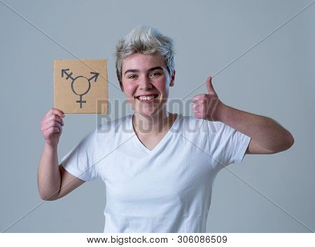 Portrait Of Happy Proud And Confident Trans Teenager Man Holding Transgender Symbol